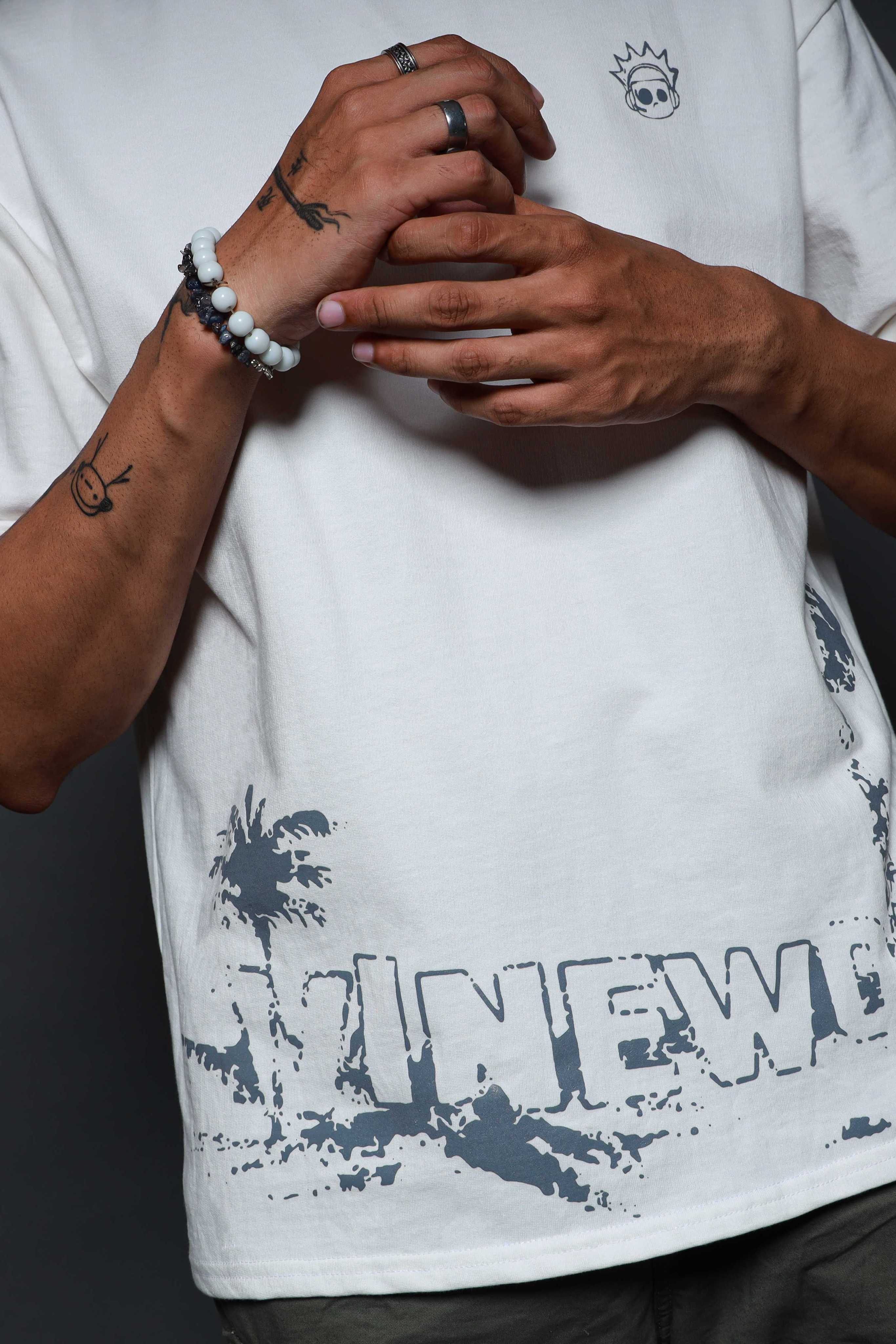 White GTA VI t-shirt close-up with bracelets